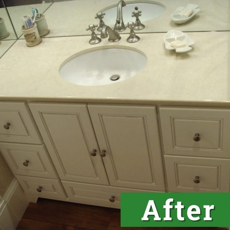 a white bathroom vanity and sink