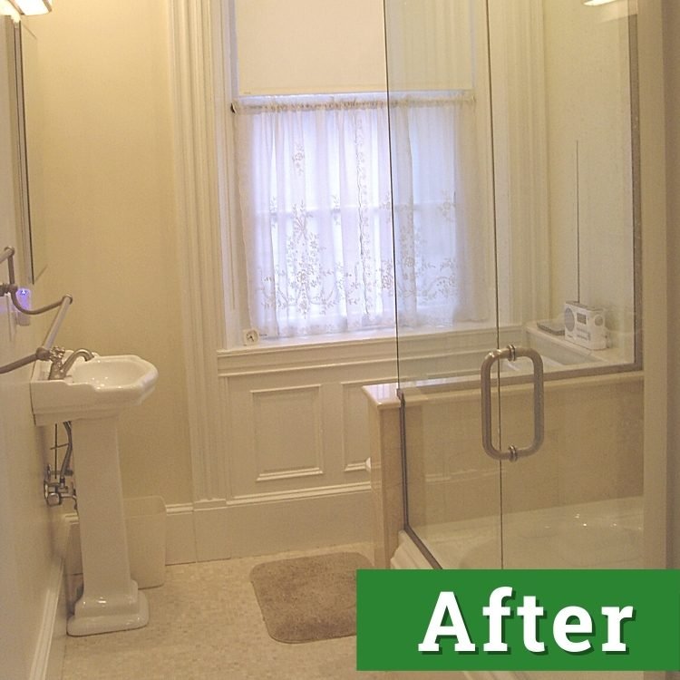 a newly remodeled bathroom with a glass enclosed tub