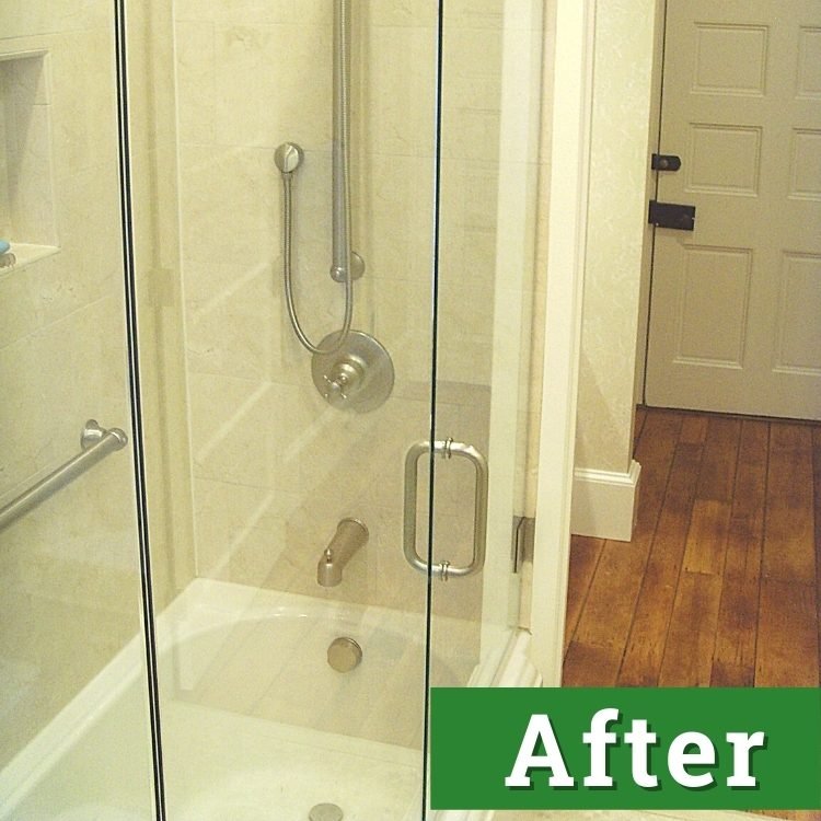 the glass door and enclosure of a newly installed bathtub