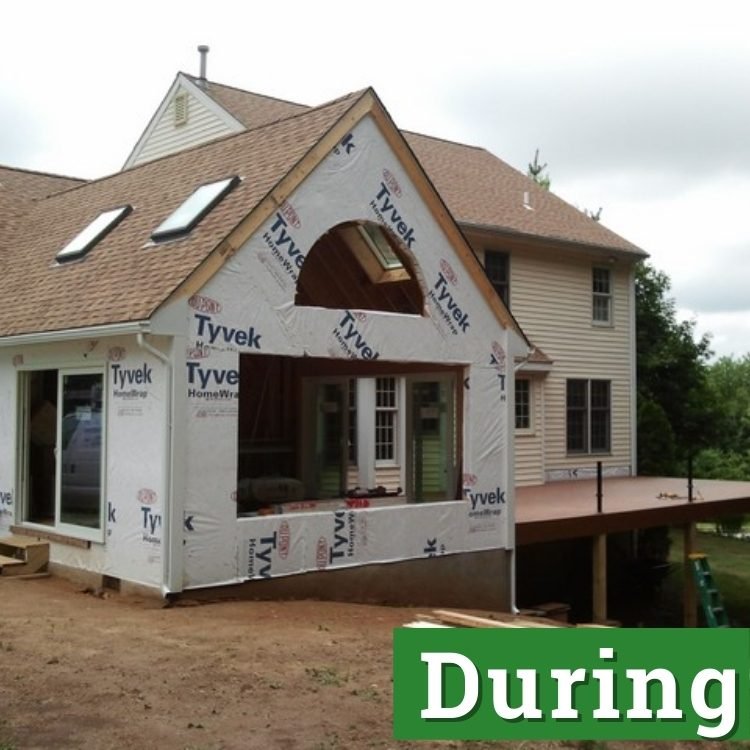 sheets of tyvek of an unfinished sunroom addition