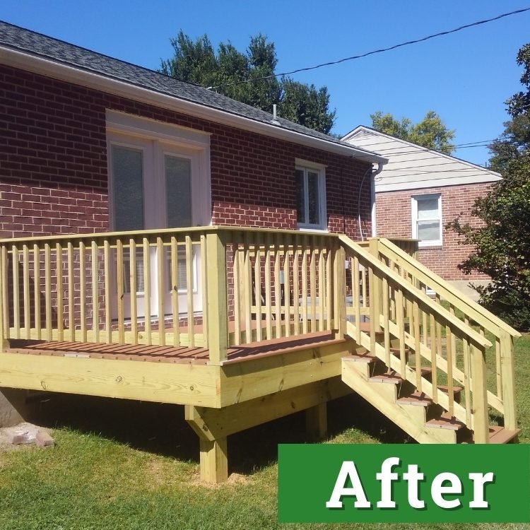 a custom built deck made with fresh wood attached to a brick house