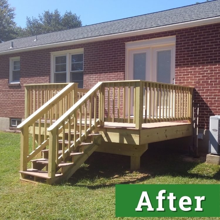 a custom built deck with stairs and a railing on the back of a brick home