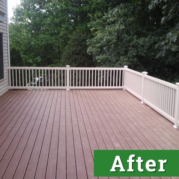 a newly built deck made with composite board and white railings