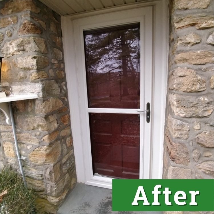 a red door with a white storm door on the front of a house