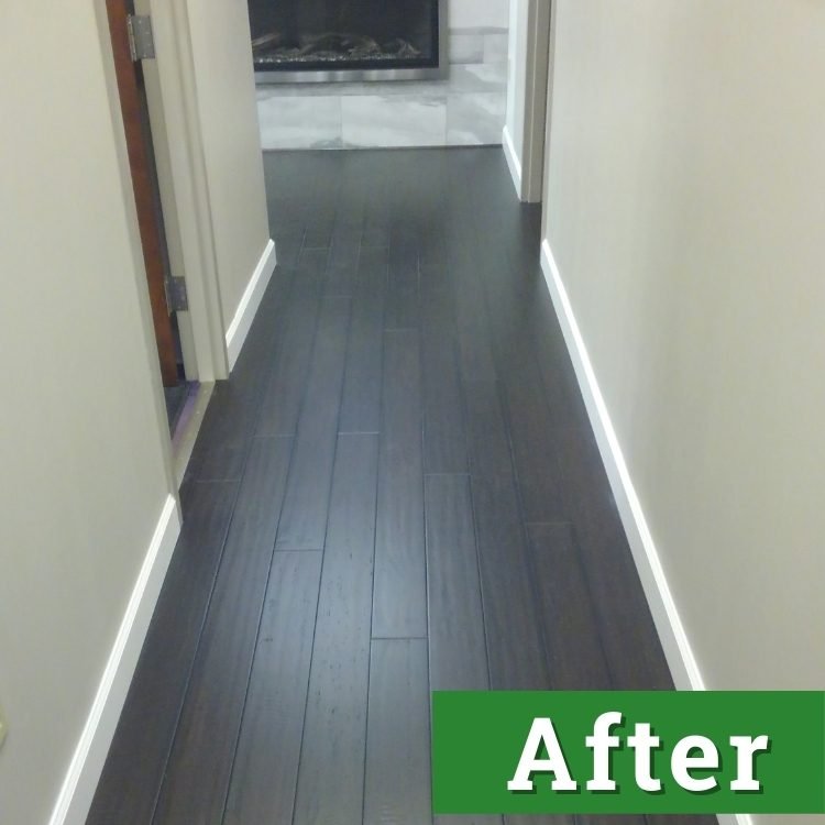 newly installed dark wood laminate flooring extends down a long hallway