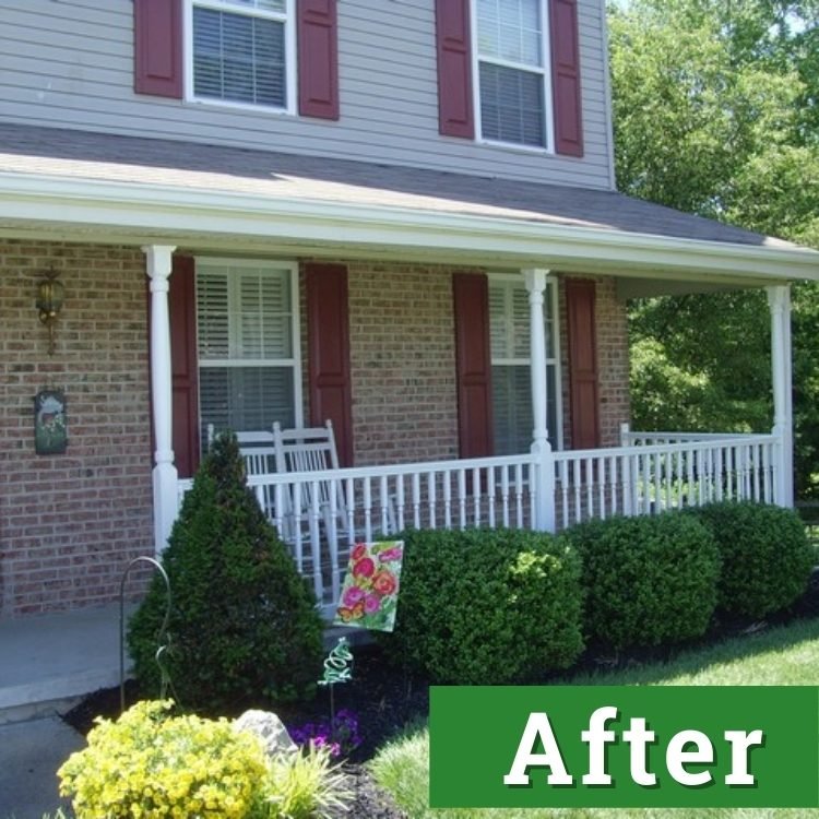 the front of a well kept home with red shutters