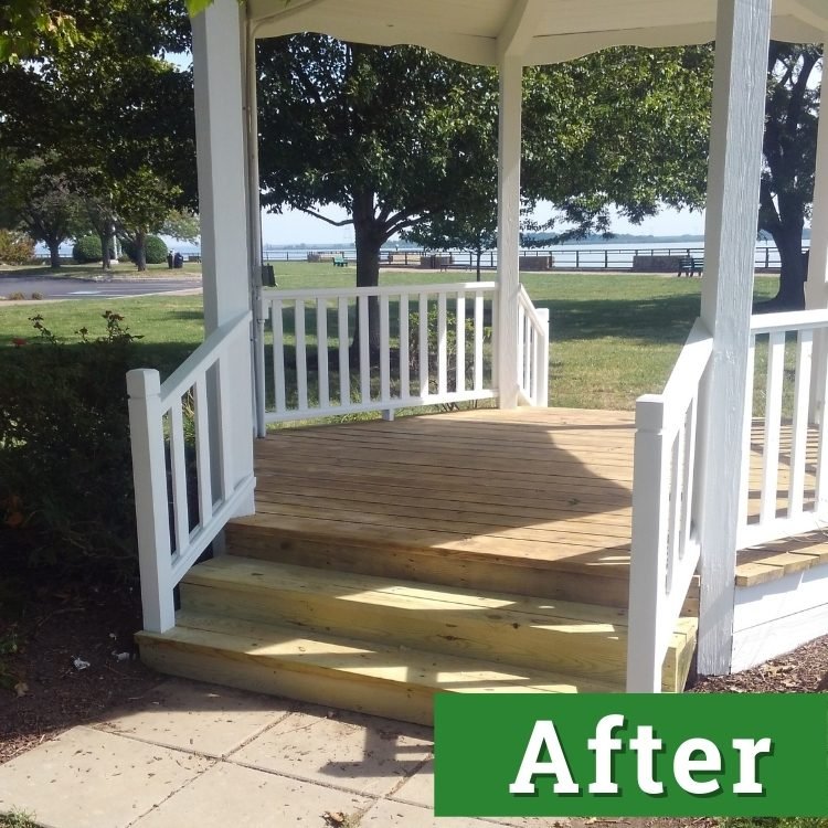 new wooden flooring and new white paint of a restored gazebo