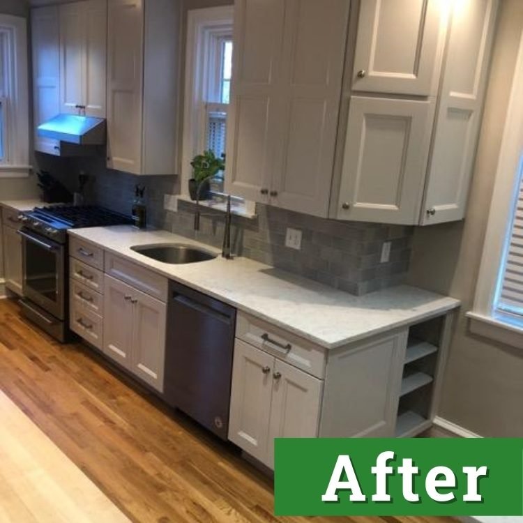 white cabinets and new stainless steel appliances in a newly renovated kitchen