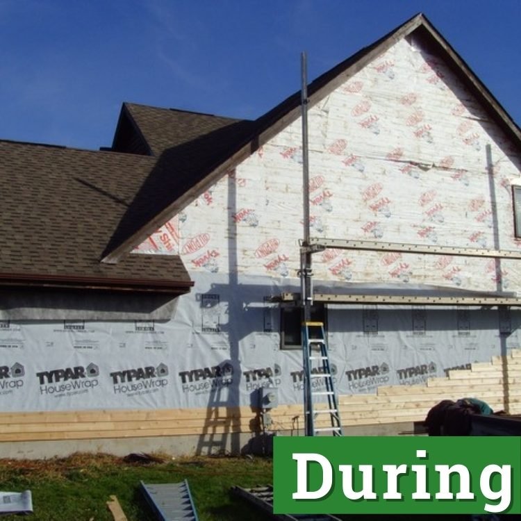 typar housewrap and tyvek on the side of a home under construction