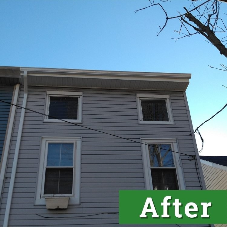 new gutters on a light gray house