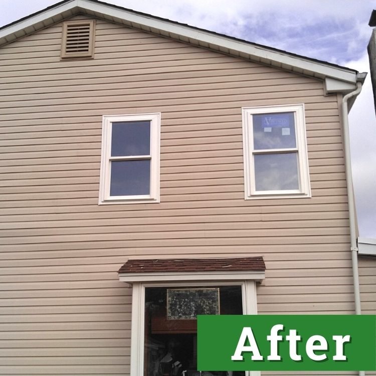 new windows and siding on a brown house