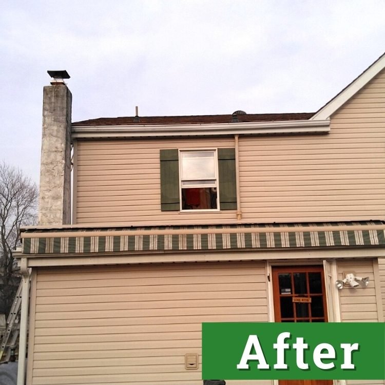 a new window with shutters on a brown house