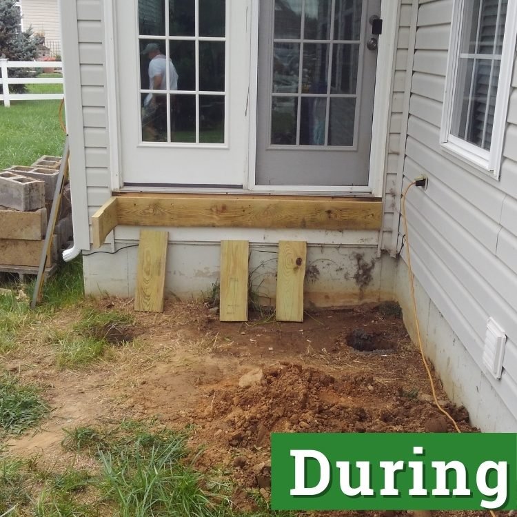 construction of wooden stairs outside of a home