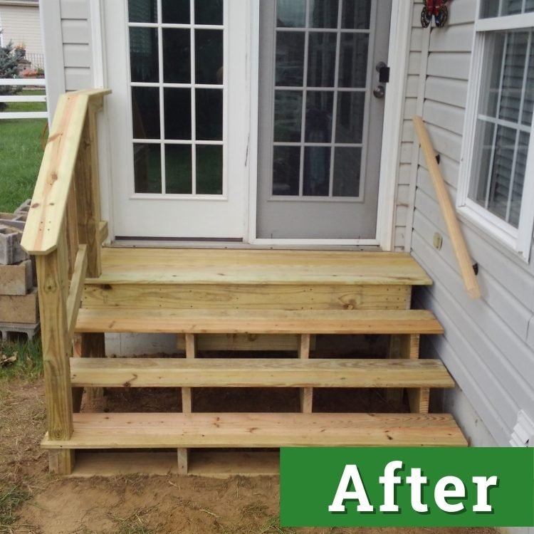 newly built wooden stairs with railings lead into a set sliding glass doors