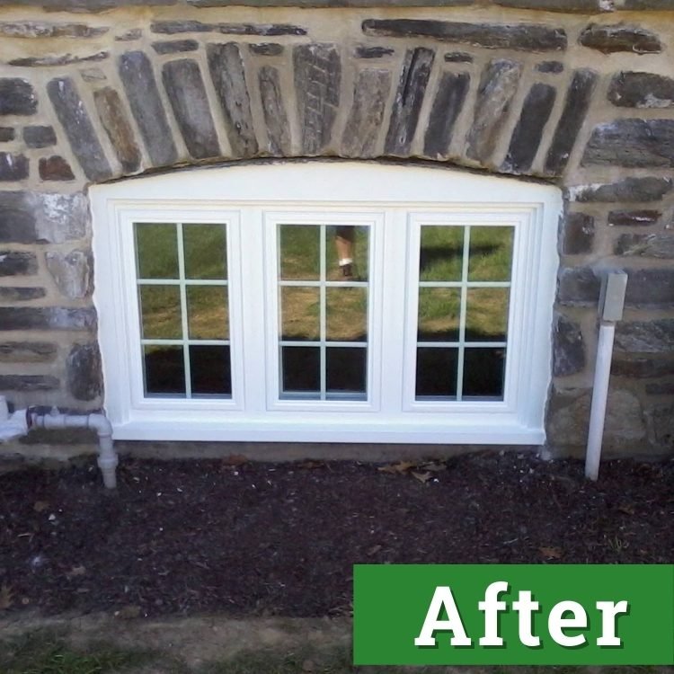 a white three pane basement window